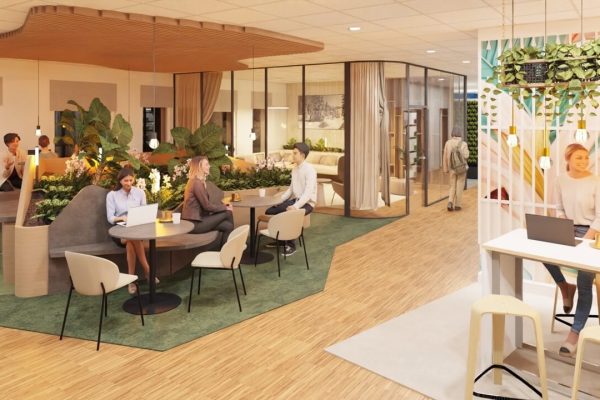 Menschen arbeiten in einem modernen Büro mit Pflanzen und Holzelementen.